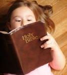Child reading a Bible