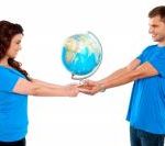 Couple in love holding a globe
