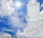 Door hanging in clouds in the sky
