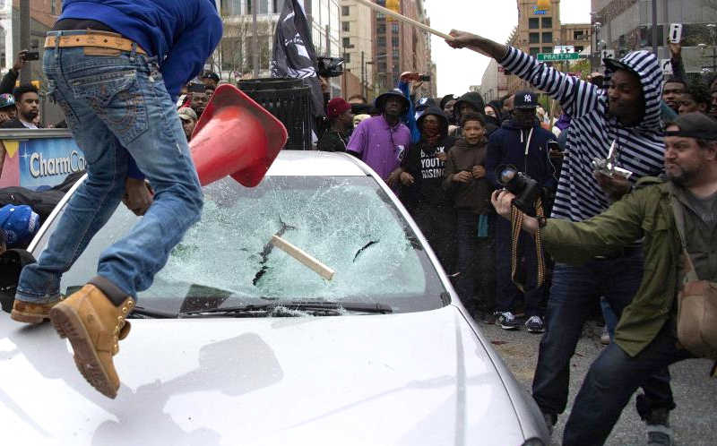 Rioters Smashing Car